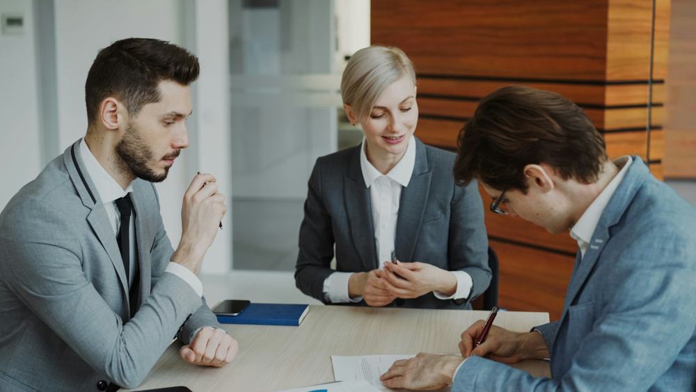 Business people talking at a meeting table