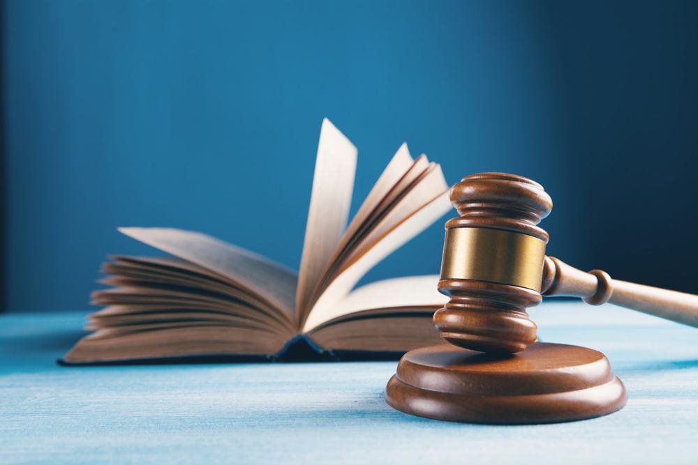 A gavel beside an open book