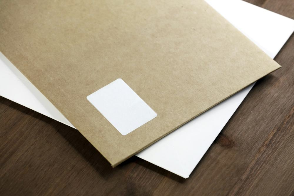 Kraft envelopes and papers on a desk