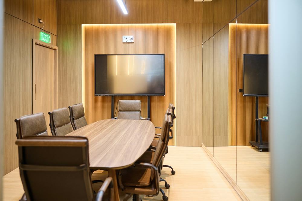 An empty meeting room with a long table